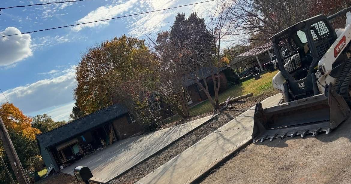 Professional Concrete Driveway Replacement installation in Cary, North Carolina by Local Concrete Contractor — commercial-grade base prep, 6-inch compacted aggregate, expansion joints sawn within 12 hours.